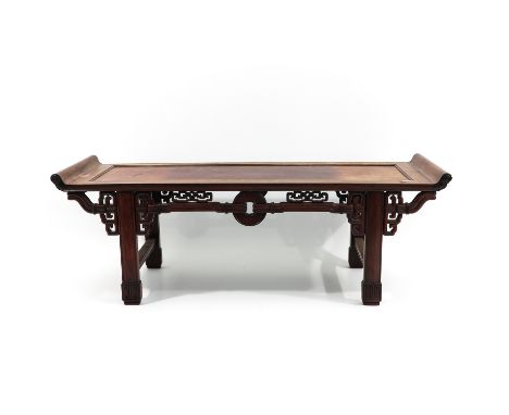 Decorated with Chinese ring and scroll work, table measures 124 x 44 x 40 cm.