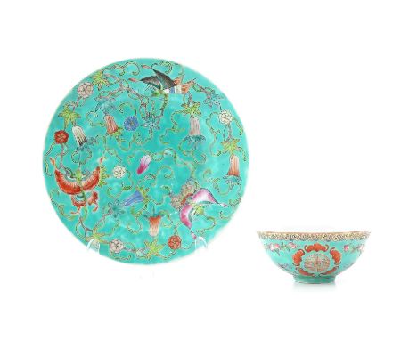 Light green ground with Famille Rose enamels depicting butterflies and birds, plate is 20 cm. in diameter. 