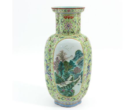 Light green ground with floral decor in Famille Rose enamels and landscape scenes, Qianlong mark, 42 cm. tall. 