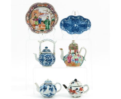 4 Teapots and 2 small trays, including Kangxi Period, tallest teapot is 10 cm., in diverse conditions.