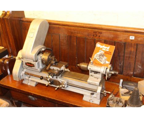 Myford ML10 Lathe with 4 jaw chuck, back gears, tools and manual.