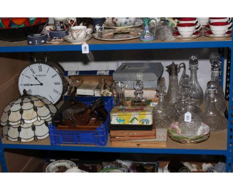 Glass decanters and claret jugs, Tiffany style shades, mantel clock, collectors plates, wood planes, artists paints, etc.