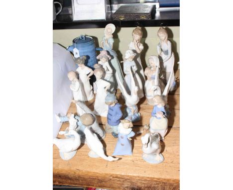 Eighteen Nao figurines, Troika Stives teapot, silver cased spoons.