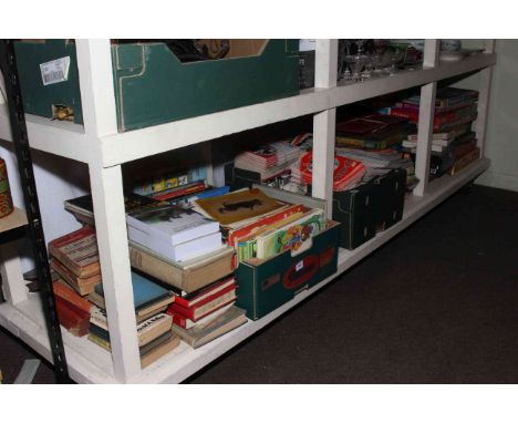 Full shelf of vintage games, football programmes, books, etc.