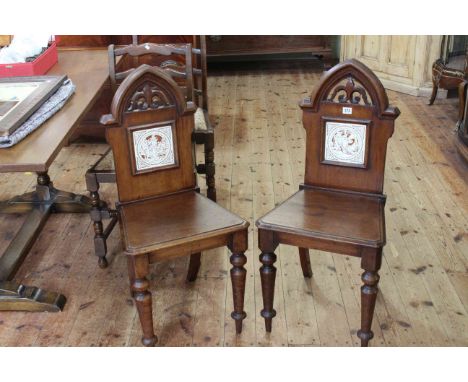 Pair Victorian mahogany Gothic hall chairs with Minton? tile insets depicting Shakespeare plays.