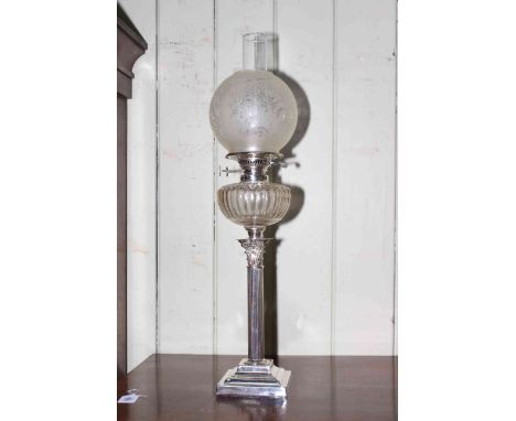 Ornate silver plate oil lamp, 70cm high.