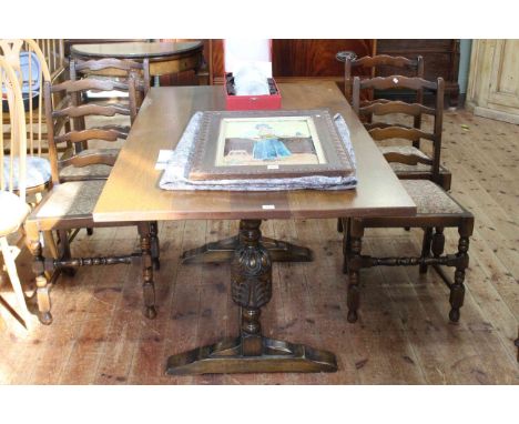 Rectangular oak dining table, 75cm by 153cm by 87cm, together with four wavy ladder back dining chairs.