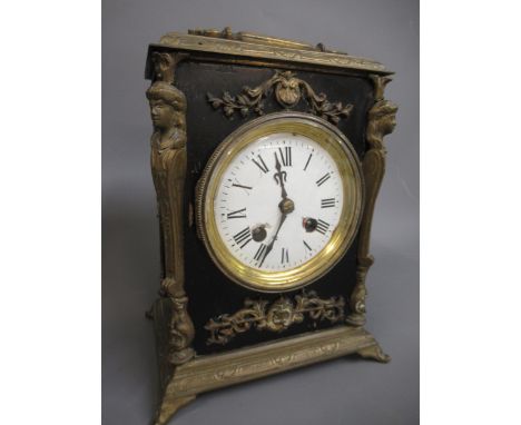 Late 19th Century French ebonised and gilt metal mounted two train mantel clock with enamel dial and Roman numerals, 8.75ins 