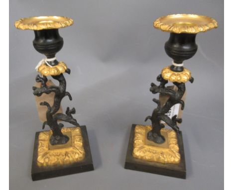 Pair of 19th Century patinated bronze and ormolu mounted candlesticks supported with stems in the form of a tree with squirre