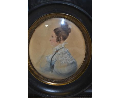 19th Century oval watercolour on paper, head and shoulder portrait, lady wearing a lace collar, in an ebonised and gilt frame