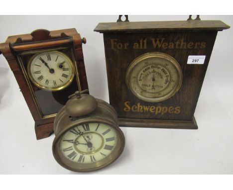 Schweppes advertising barometer, a brass drum form alarm clock and an American mantel clock 
