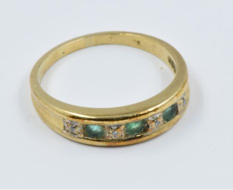 Gold, emerald and diamond channel set ring 