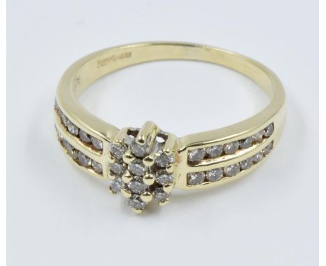 9ct Yellow gold diamond cluster ring with diamond set shoulders 