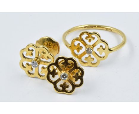 18ct Gold diamond set ring of pierced floral design, together with matching ear studsSize L 