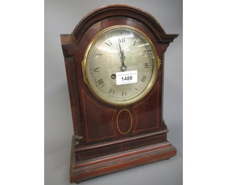 Edwardian mahogany line inlaid mantel clock having circular silvered dial with Roman numerals and two train movement striking