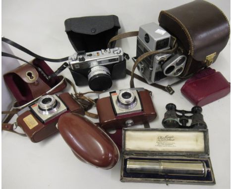 Leather cased early calculator, pair of opera glasses in partial leather case, three various cameras and a Bell & Howell cine