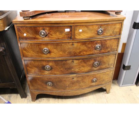 19th Century mahogany bow front chest of two short and three long graduated drawers with brass ring handles and bracket feet,