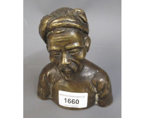 Small oriental dark patinated bronze bust of a gentleman, 5ins high 