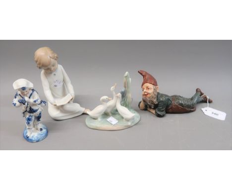 Small Continental painted terracotta figure of a gnome, Nao figure of a child reading, Nao group of ducks and a small blue an