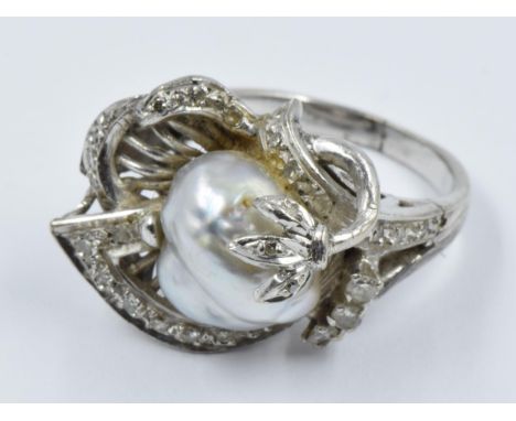 Continental dress ring set baroque pearl and multiple diamonds 