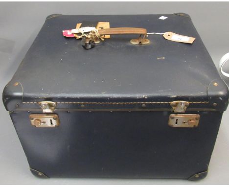 Vintage hat box containing various hats 