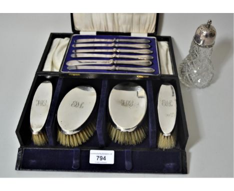 Cased set of four silver backed brushes, cased set of six silver handled tea knives and a silver mounted cut glass sugar cast