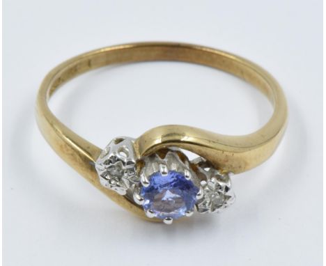 9ct Yellow gold tanzanite and two stone diamond set ring 