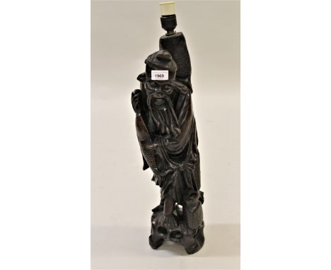 Late 19th / early 20th Century Chinese carved hardwood table lamp in the form of a fisherman, 21.5ins high 