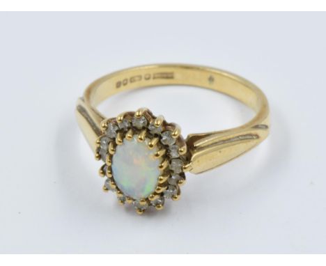 9ct Gold oval opal and diamond cluster ring 