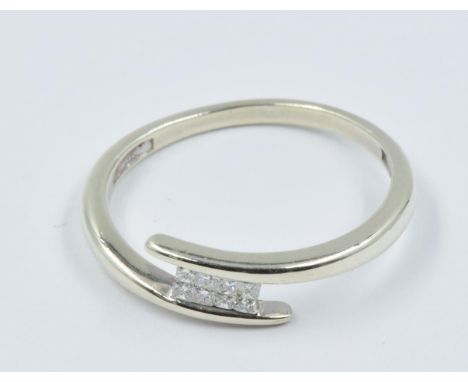 9ct White gold crossover ring set eight small square cut diamonds 