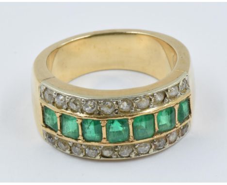 18ct Yellow gold ring set with a band of seven emeralds flanked by two rows of old cut diamondsRing size L/MWeight - 9g 