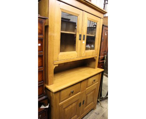 Good quality 20th Century light oak dresser, the moulded cornice above two glazed doors, two drawers and two panel doors, 50i