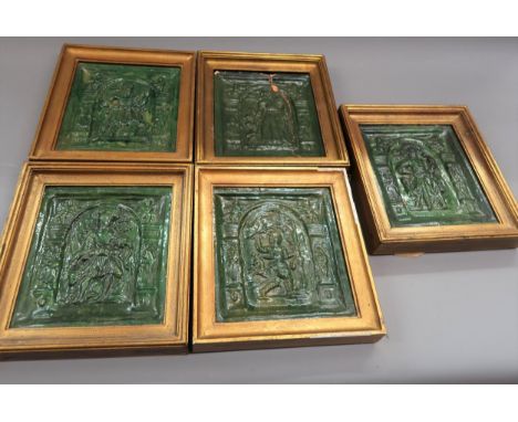 Group of four 16th Century German green glazed pottery stove tiles decorated in high relief, each 8.5ins x 7.5ins approximate