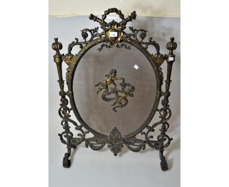 Good quality Edwardian dark patinated brass and wire mesh firescreen of ornate design, 34ins x 24insFeet loose but could be t
