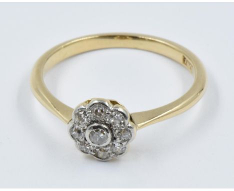 18ct Yellow gold nine stone diamond flowerhead ringGood general condition with slight signs of wear. Centre stone approximate