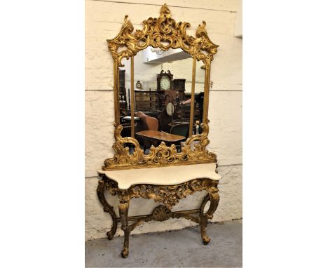 Good quality reproduction carved gilt wood console table with mirror in Louis XV style, the segmented mirror with floral surm