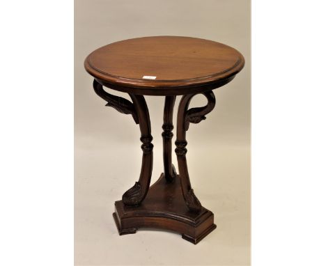 Late 20th Century circular mahogany lamp table, raised on three carved swan head supports with triform base, 21.5ins diameter