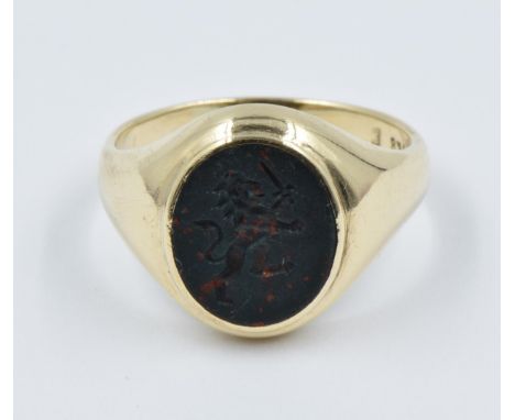 9ct Yellow gold intaglio hardstone signet ringIn very good condition with slight signs of wear, 4.2g and ring size M/NSome sc