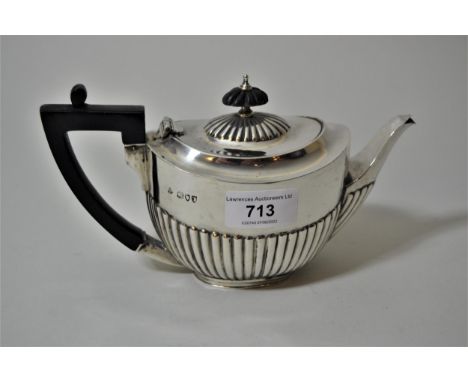 Small London silver bachelor's teapot, with half gadroon decoration and ebonised handle, 7.5 troy oz.Does have small dents to