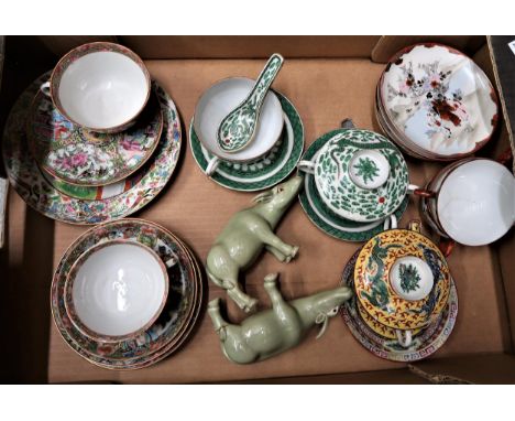Box containing a small quantity of various oriental porcelain including teaware and a pair of green glazed figures of water b