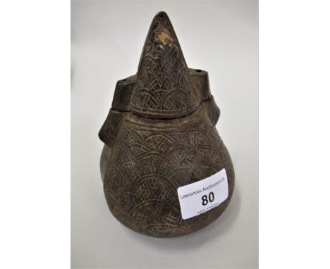 African (Congolese) powder flask and cover of conical form with all-over stylised carved low relief decoration, 5.5ins high 