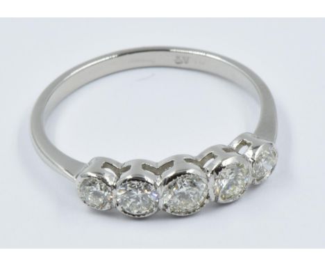 Platinum and five stone diamond ring with rub-over setting, approximately 0.7ct totalThis is a modern ring in 'as new' condit