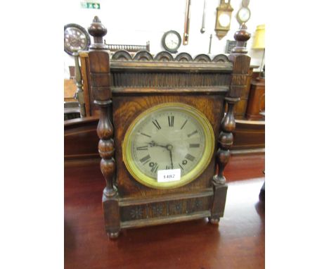 Edwardian oak two train mantel clock with silvered dial and Roman numerals, together with an oak aneroid barometer / thermome