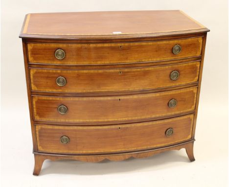 Good quality reproduction mahogany satinwood crossbanded bow fronted chest of four graduated drawers, with brass ring handles