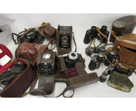 Box containing a quantity of vintage cameras, binoculars and opera glasses 