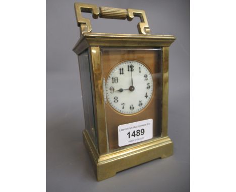 20th Century gilt brass cased carriage clock having circular dial with Arabic numerals and single train keywind movement (inc