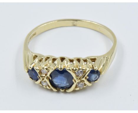 9ct Yellow gold three stone sapphire and four stone diamond ringA relatively modern ring in excellent conditionNo damage, wea