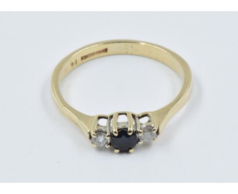 9ct Yellow gold three stone ring set central sapphire flanked by two diamonds 