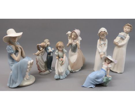 Six various Nao figures together with a Lladro groupOne figure with basket of flowers is missing a finger 