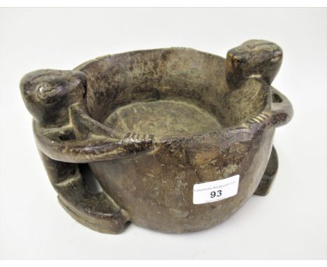 Native carved tribal art bowl, the side handles in the form of two seated figures, 10.5ins x 5.5ins 